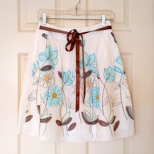 NWOT. Beautiful Skirt with multi color embroidered flowers, ribbon & full lining